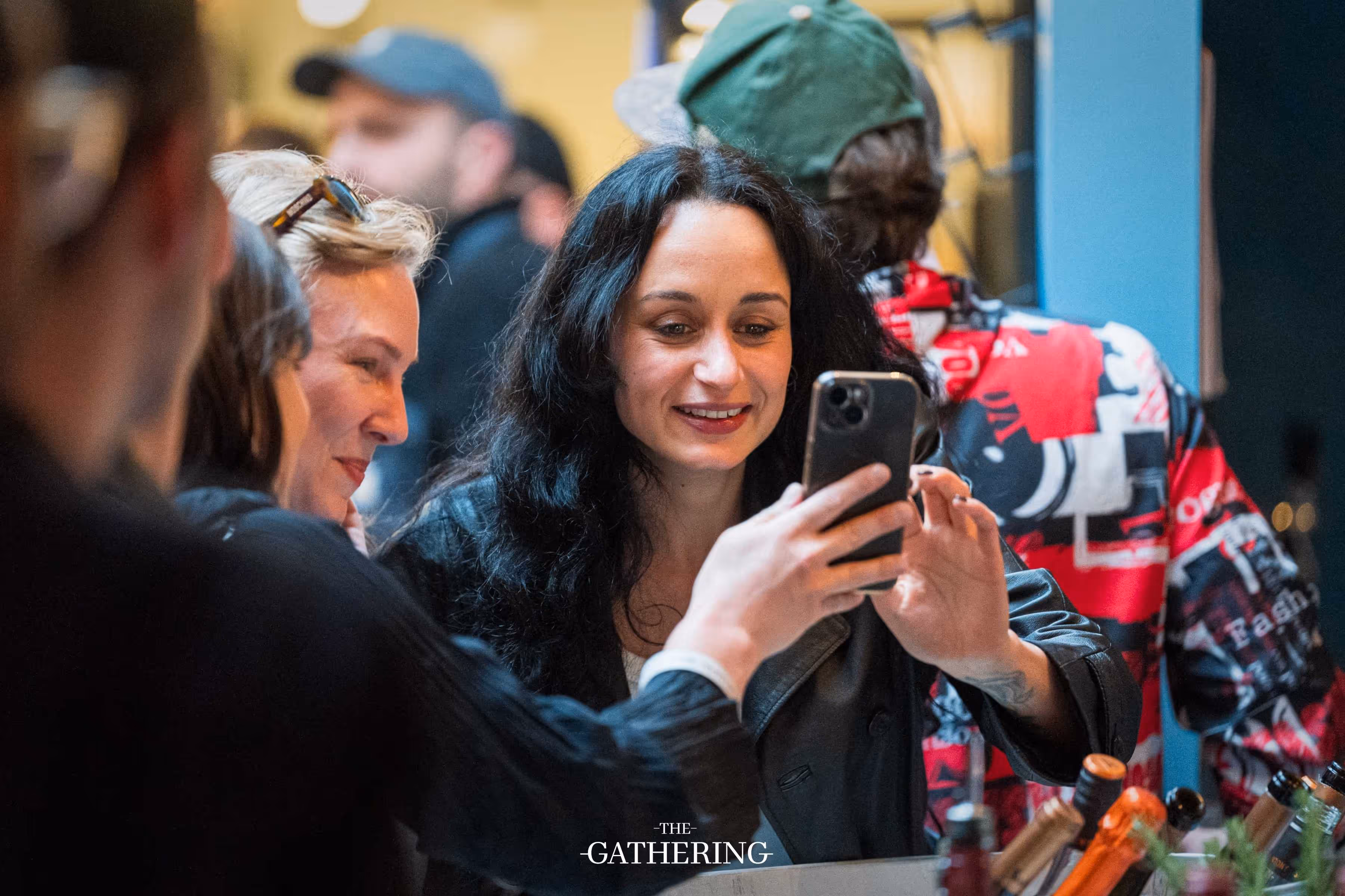 Crowd mingling with drinks at The Gathering hosted by Maison ACME