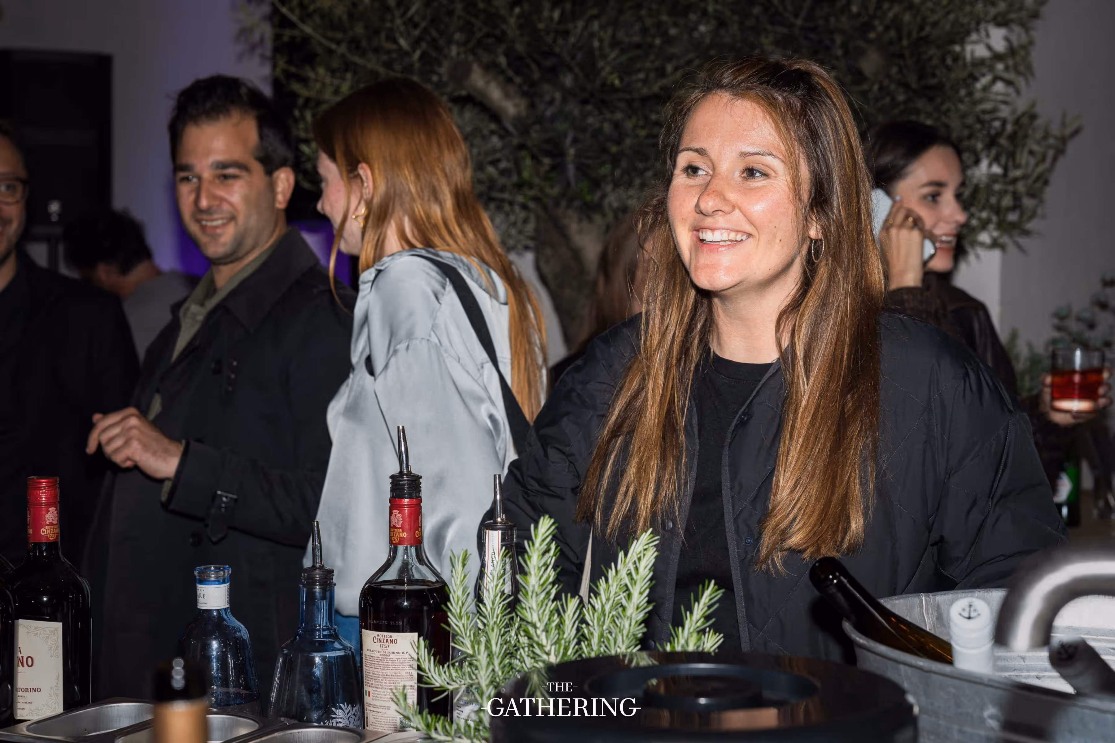 Crowd mingling with drinks at The Gathering hosted by Maison ACME