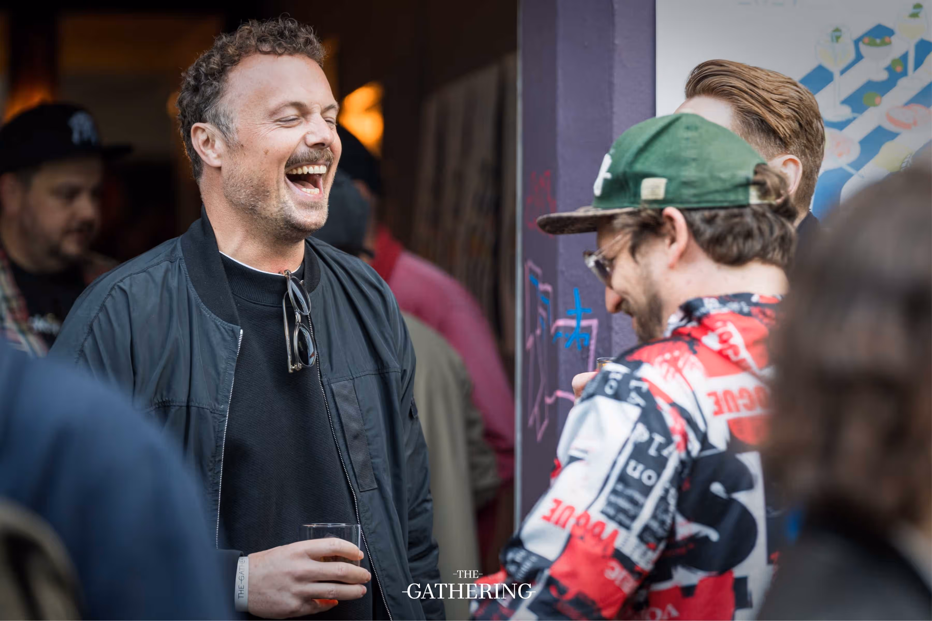 Crowd mingling with drinks at The Gathering hosted by Maison ACME