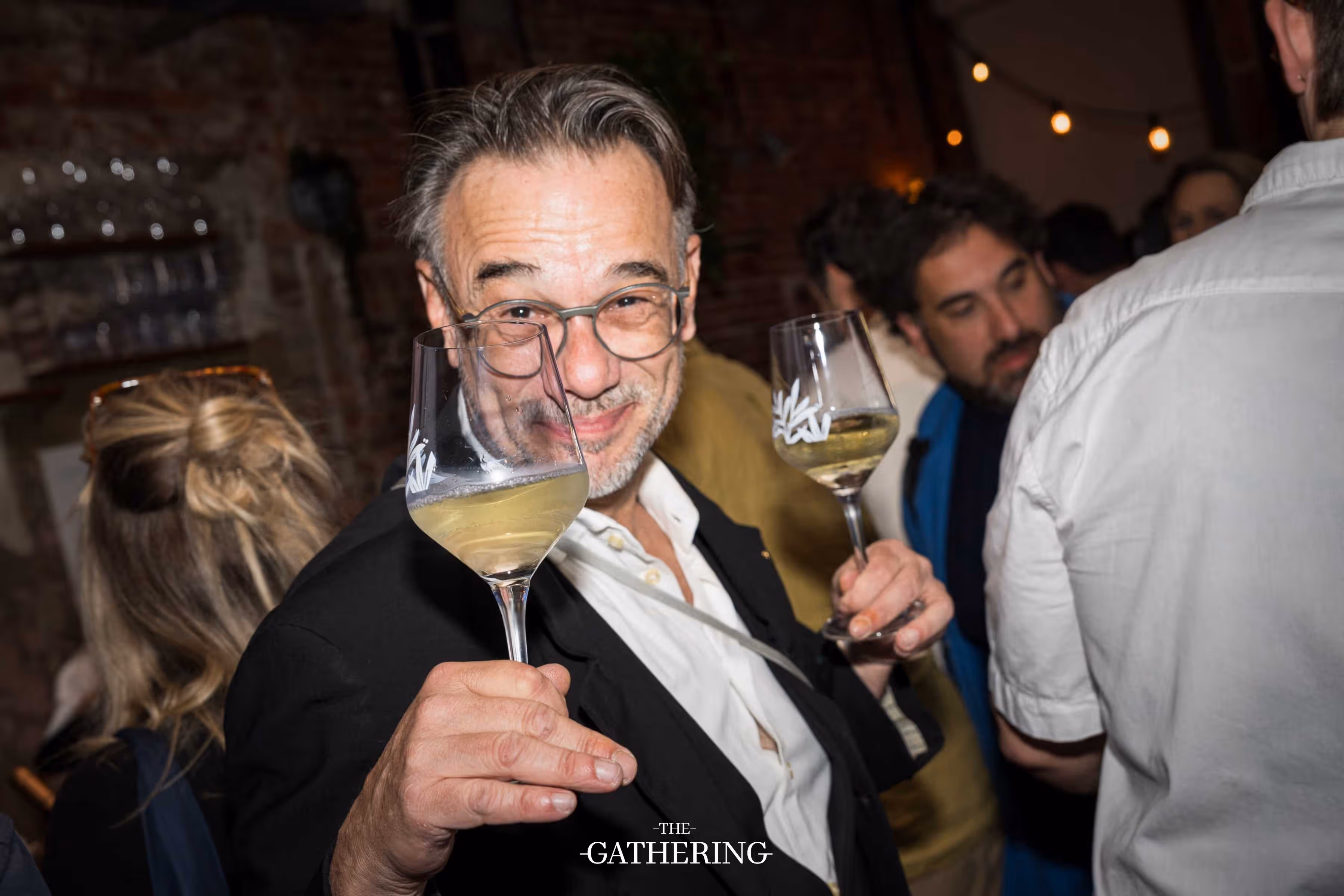 Crowd mingling with drinks at The Gathering hosted by Maison ACME