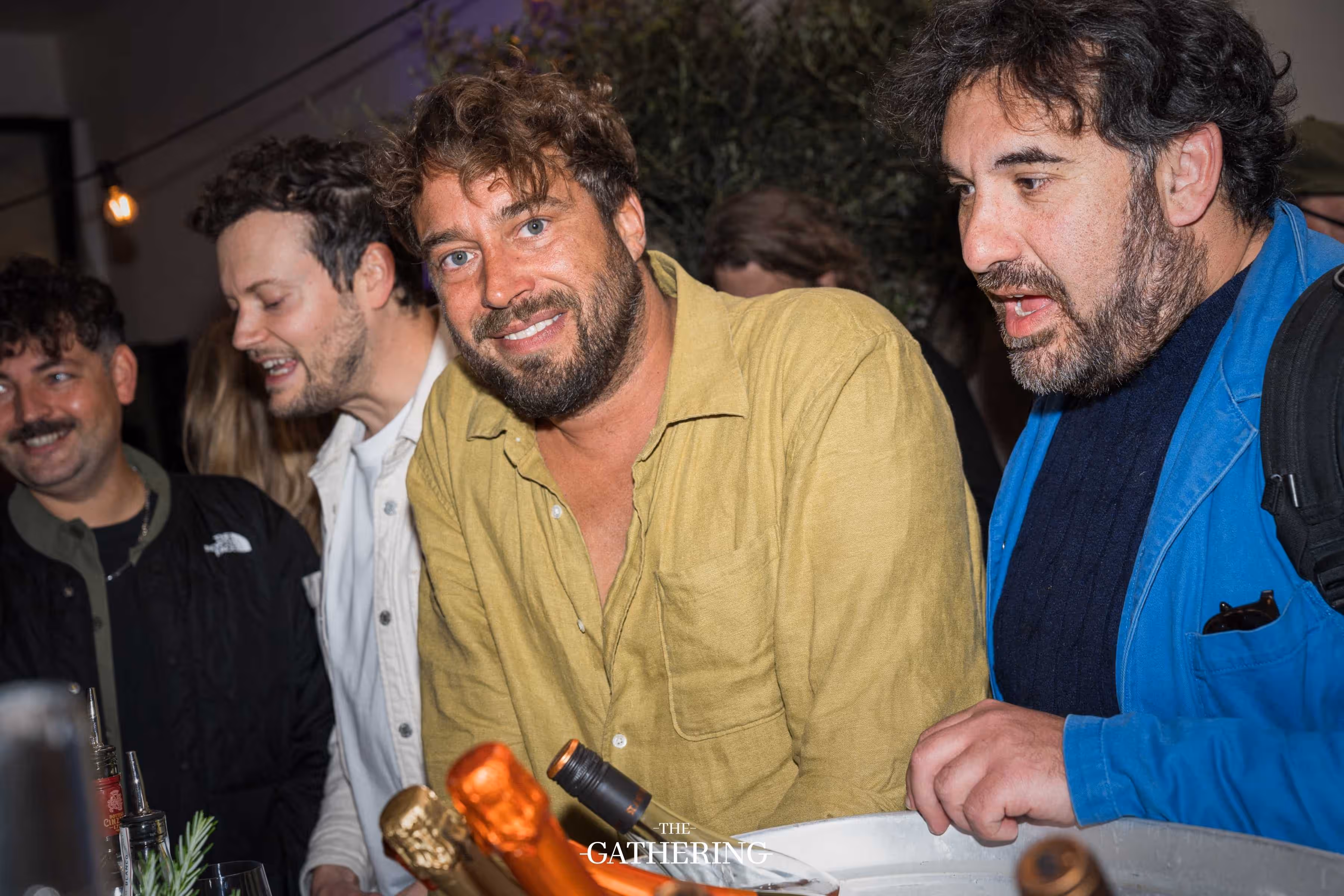 Crowd mingling with drinks at The Gathering hosted by Maison ACME