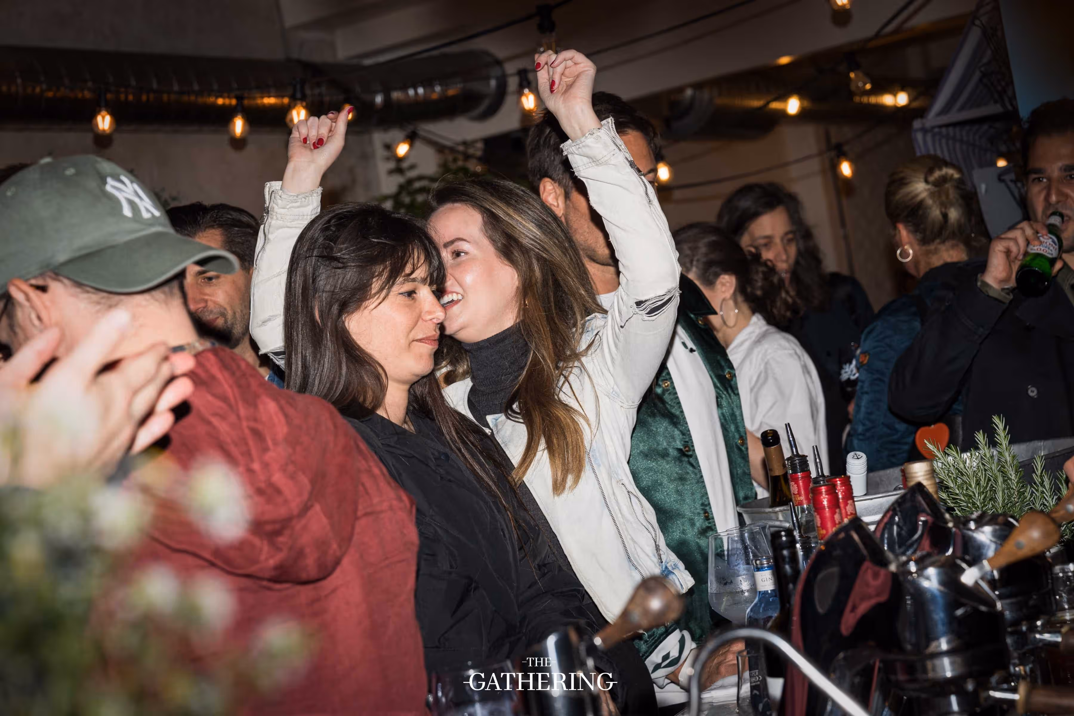 Crowd mingling with drinks at The Gathering hosted by Maison ACME