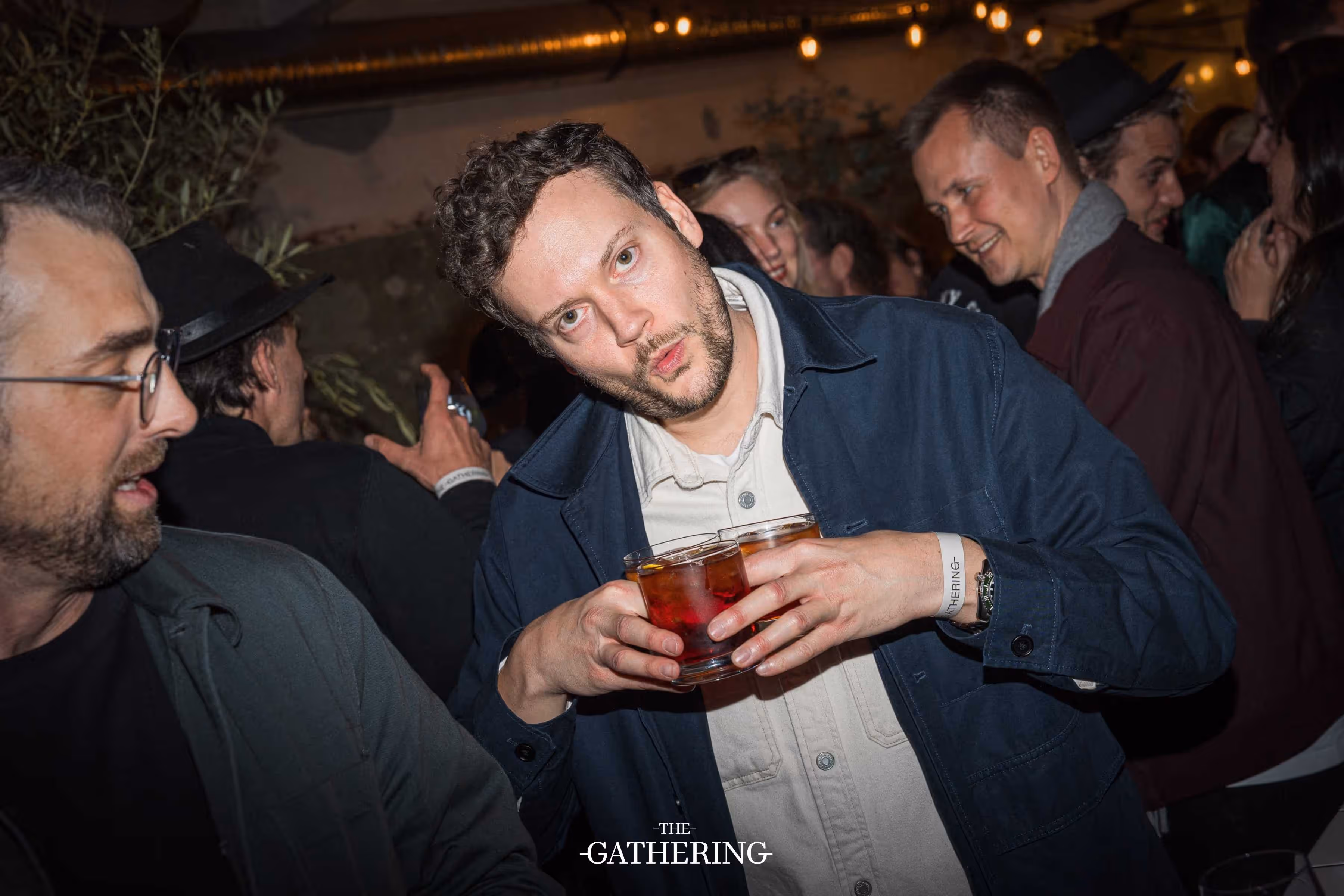 Crowd mingling with drinks at The Gathering hosted by Maison ACME