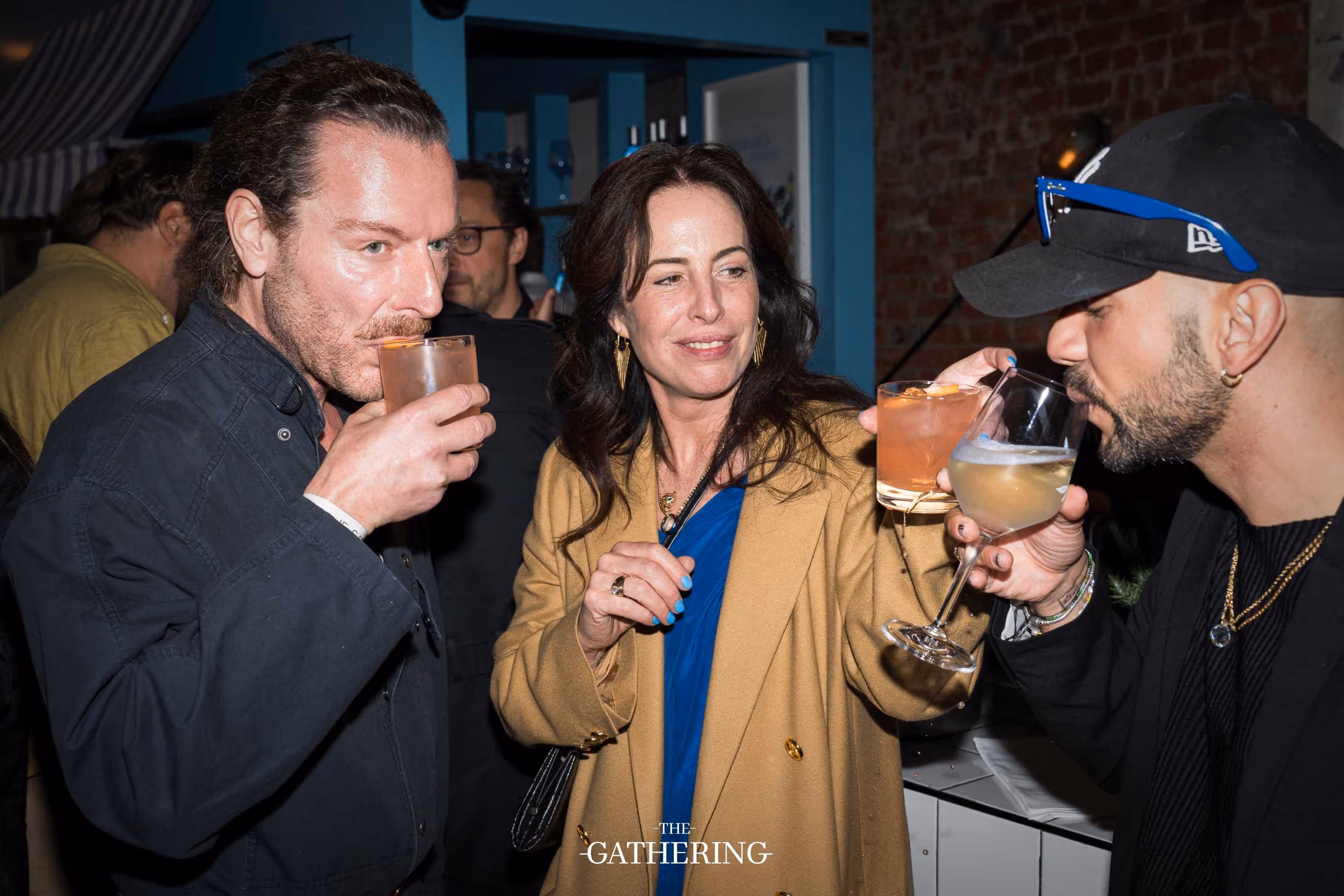 Crowd mingling with drinks at The Gathering hosted by Maison ACME