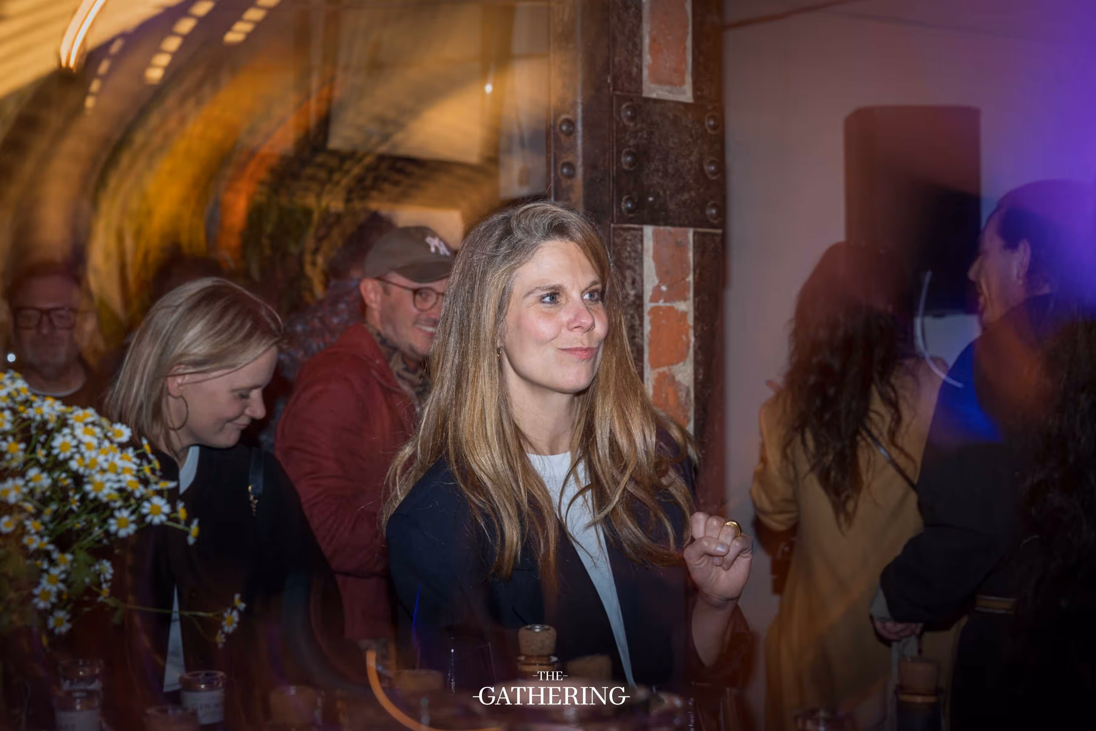 Crowd mingling with drinks at The Gathering hosted by Maison ACME