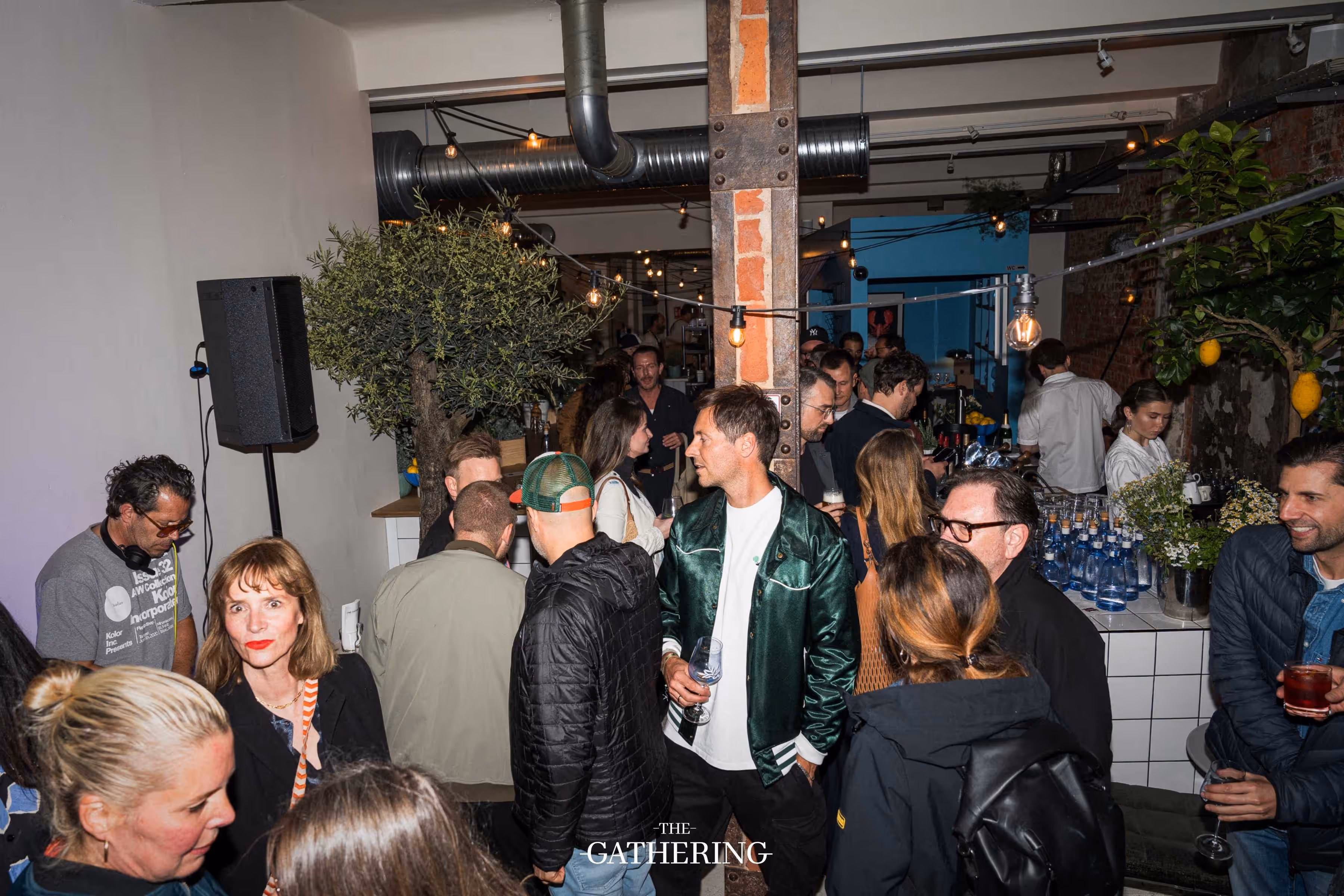 Crowd mingling with drinks at The Gathering hosted by Maison ACME