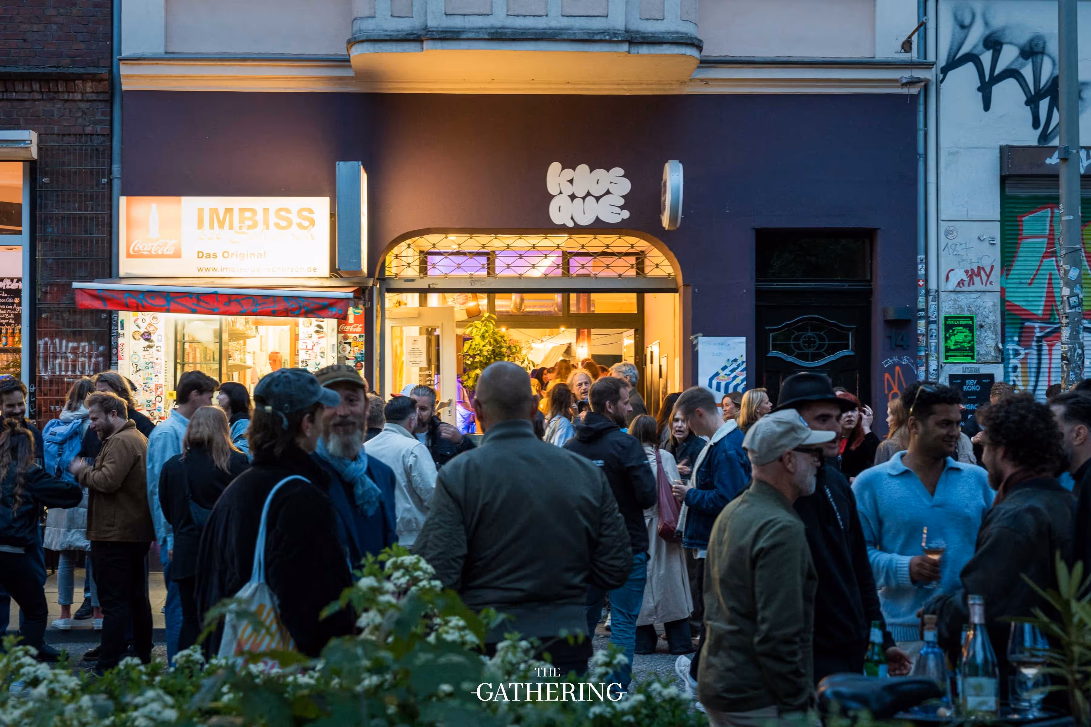 Crowd mingling with drinks at The Gathering hosted by Maison ACME
