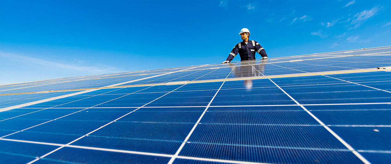 A inspector is using AI technology to better detect issues on solar panels