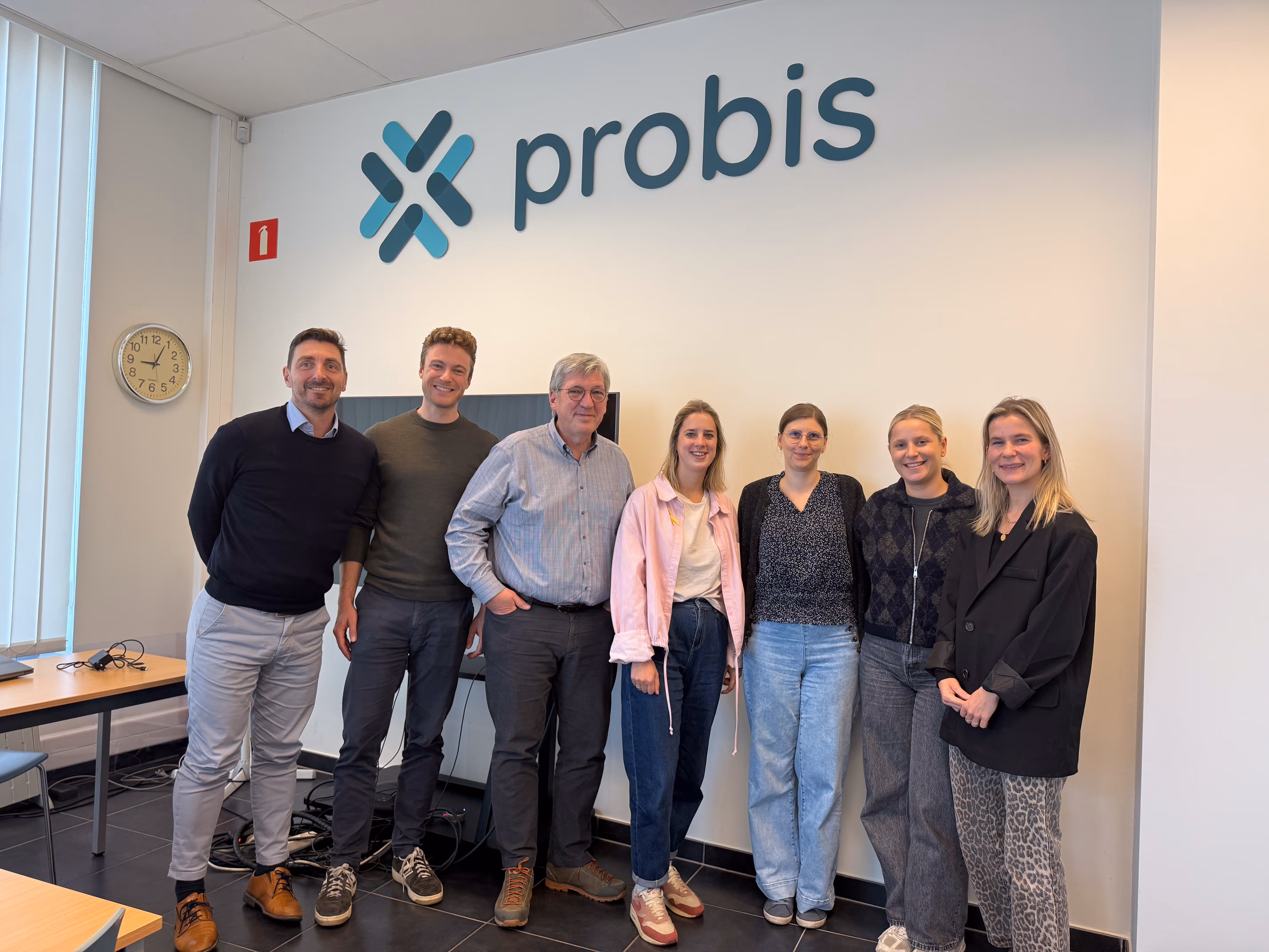Team members from Faktion and Probis standing together at the Probis office to mark the announcement of their new AI partnership.