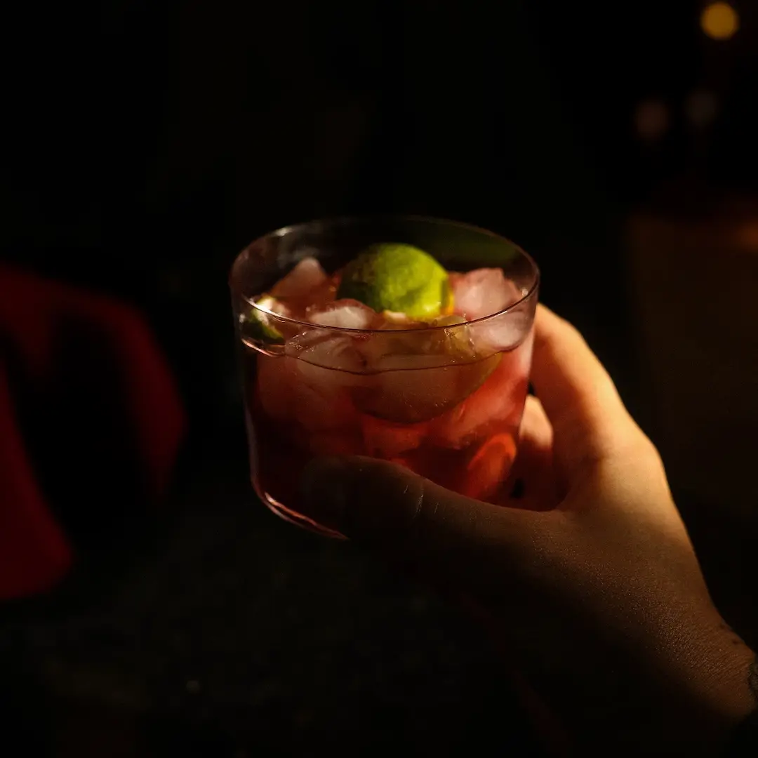 Non-alcoholic Caipiritaly cocktail on a dark background