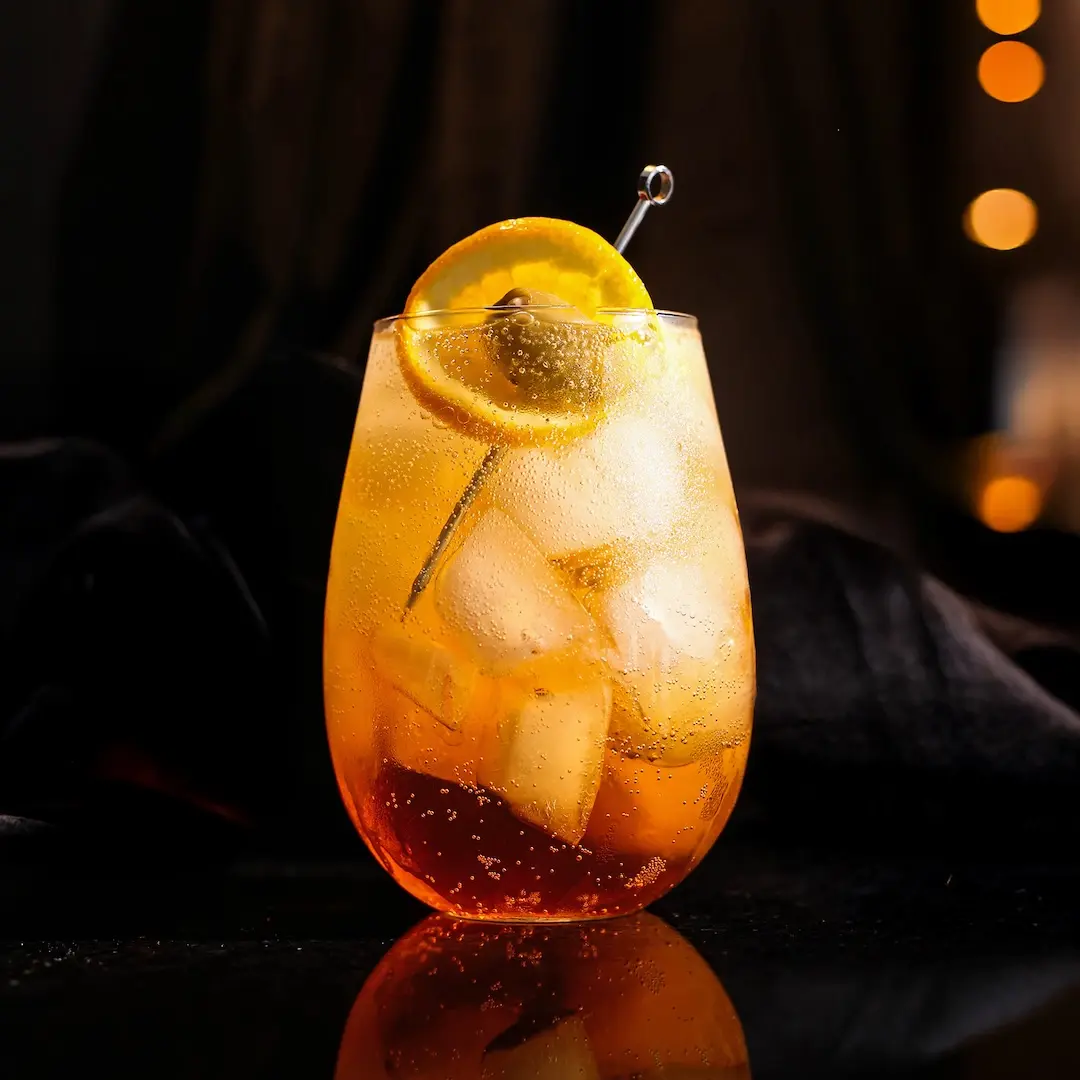 Non-alcoholic Spritz cocktail on a table with a dark background