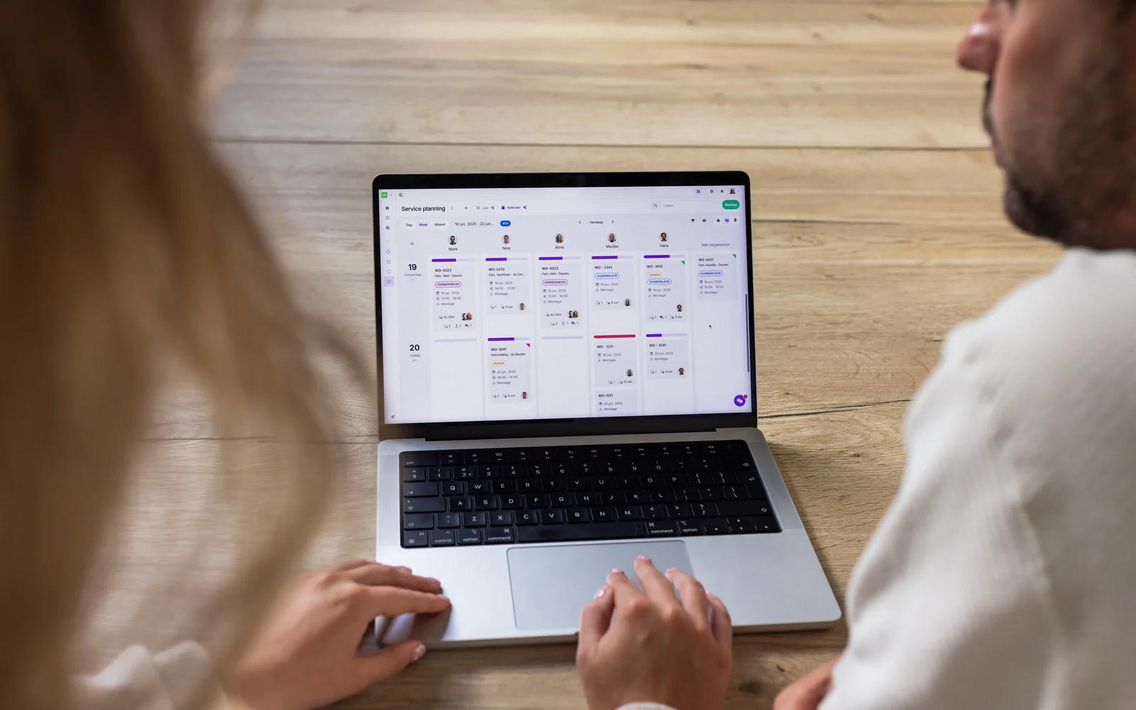 Person working in vPlan’s service planning on a laptop.