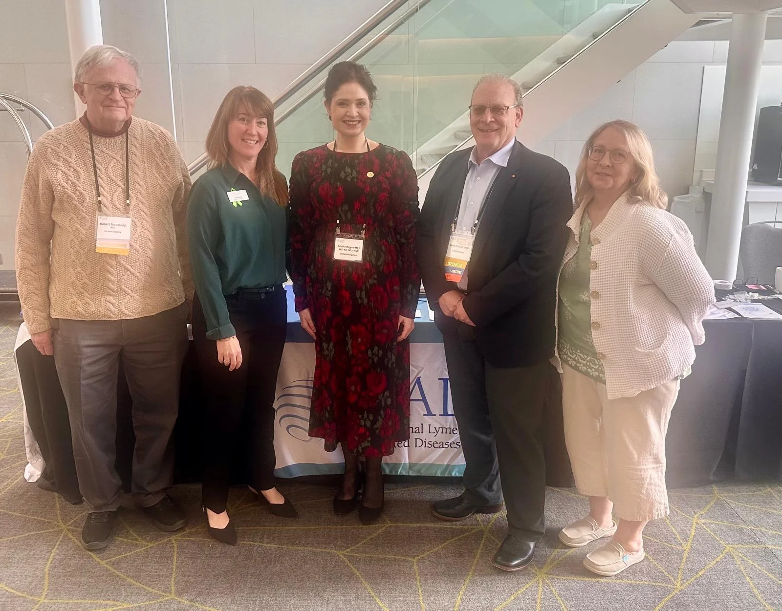 Dr Minha Rajput-Ray with Dr Robert Bransfield, Dr Garth Ehrlich and members of the ILADS team at the ILADS European Scientific Conference on Lyme disease, London, 2026