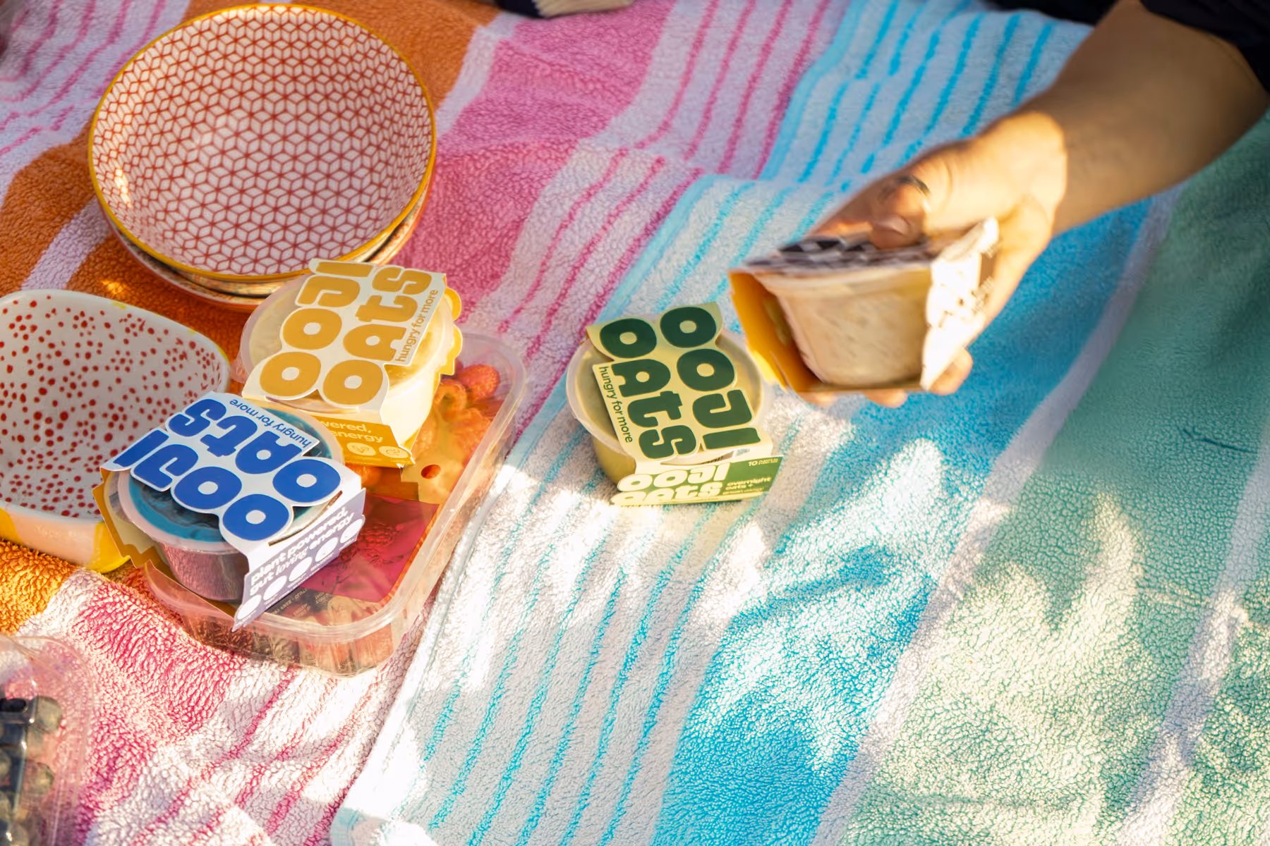 ooji oat pots on a picnic blanket