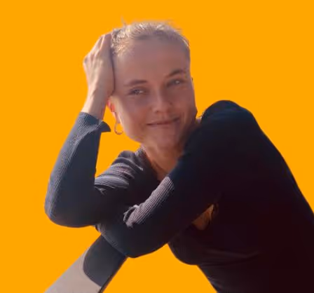 girl smiling with resting on a bar