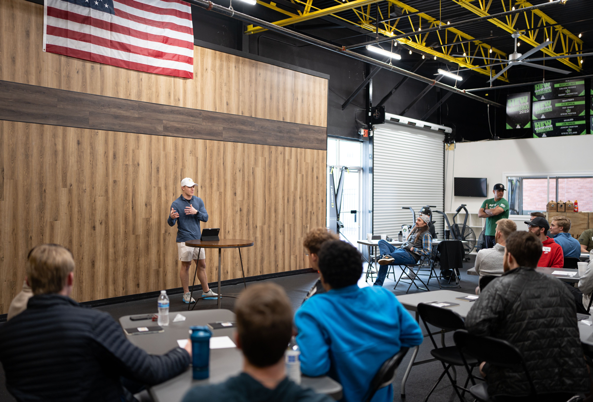 Take A Step Workshops | Josh Presenting at a Workshop in front of several young men