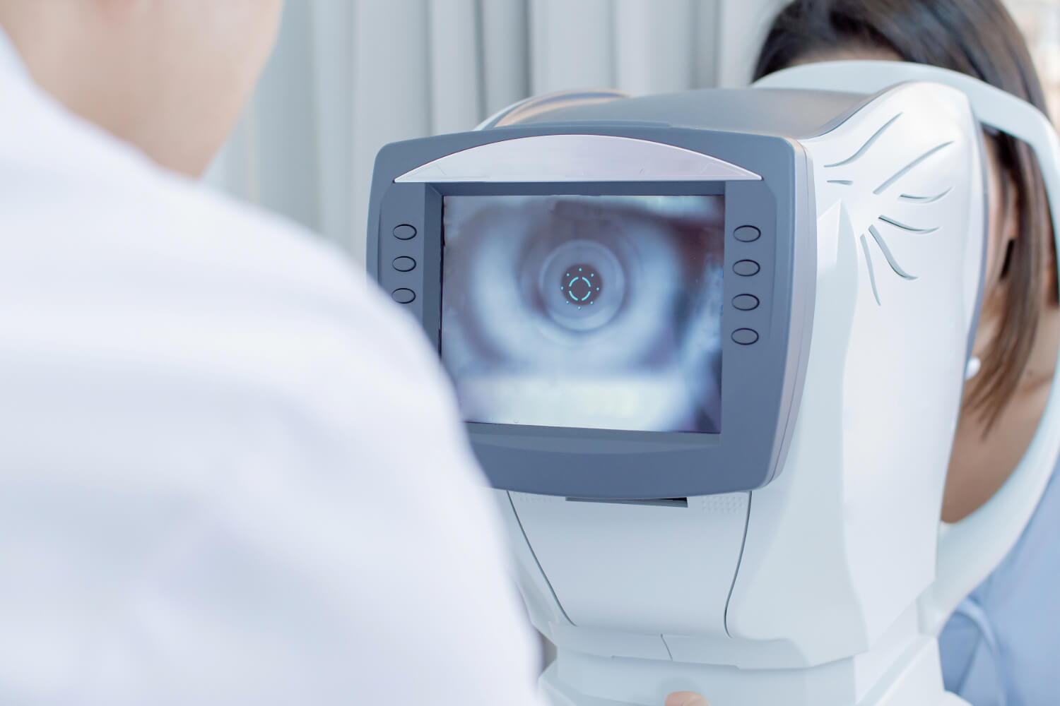 Close-up of eye exam with autorefractor machine
