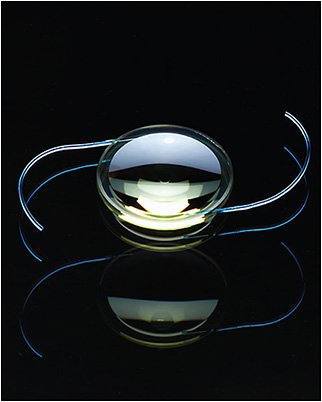 Artificial intraocular lens implant on black background