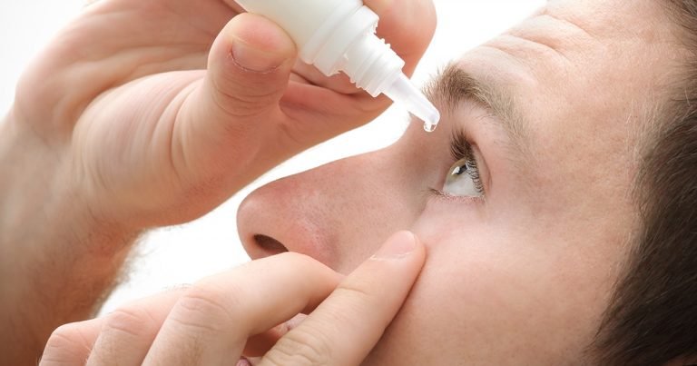 Man applying eye drops