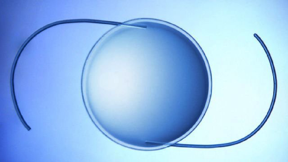 Artificial intraocular lens on blue background