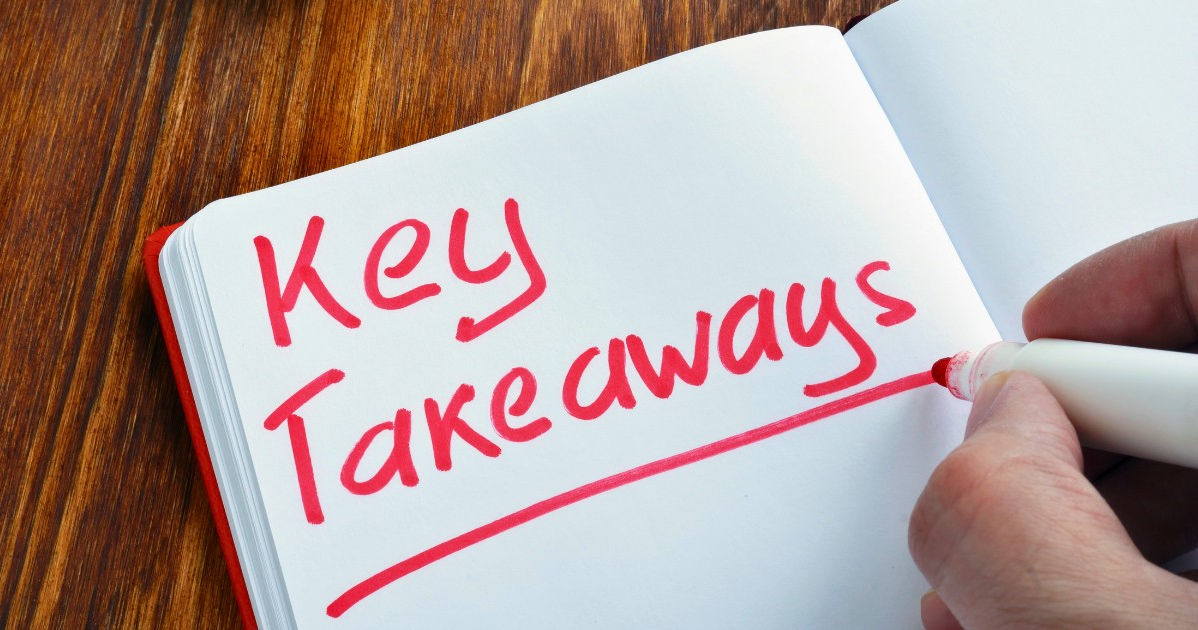 a paper book with key takeaways written on one of the pages