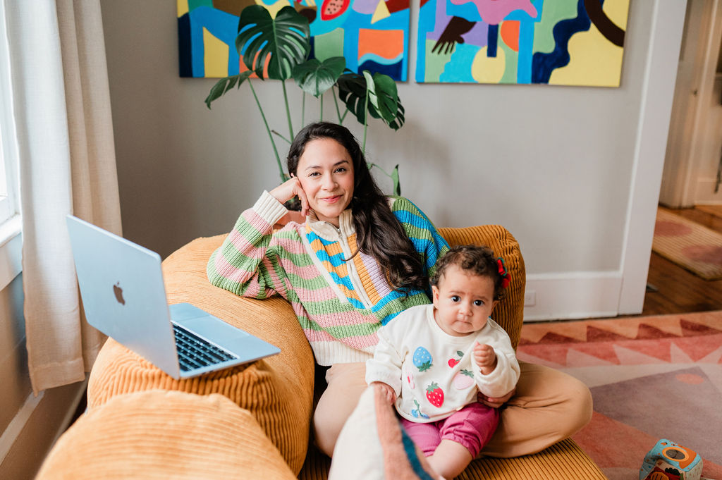Nicol Perez sitting with her baby