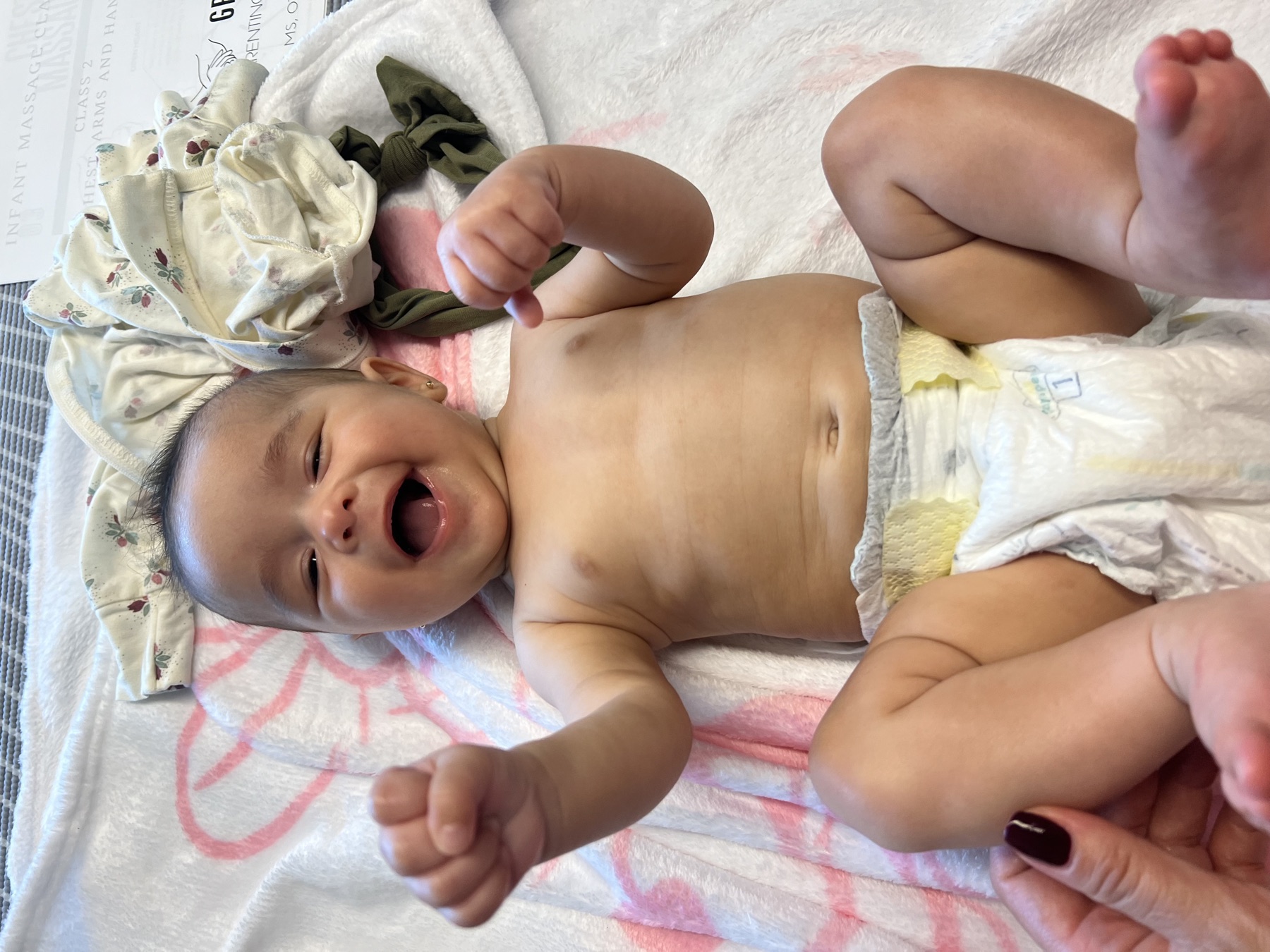 Smiling baby during developmental play