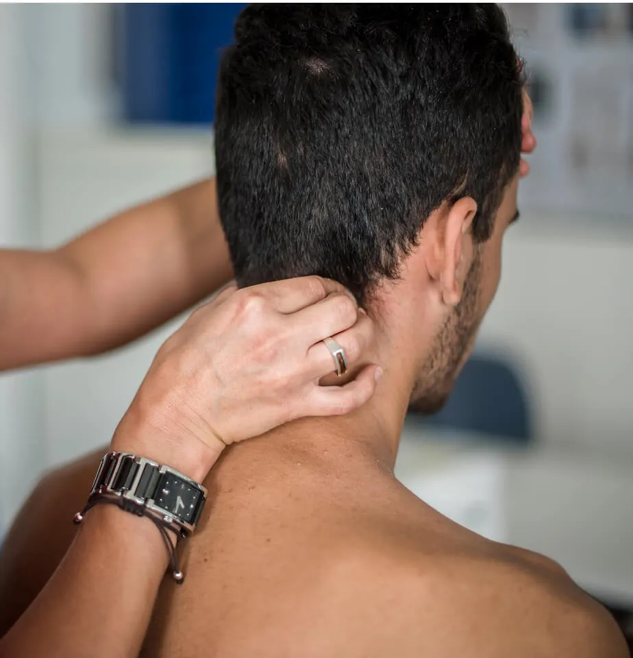 patient getting neck examined