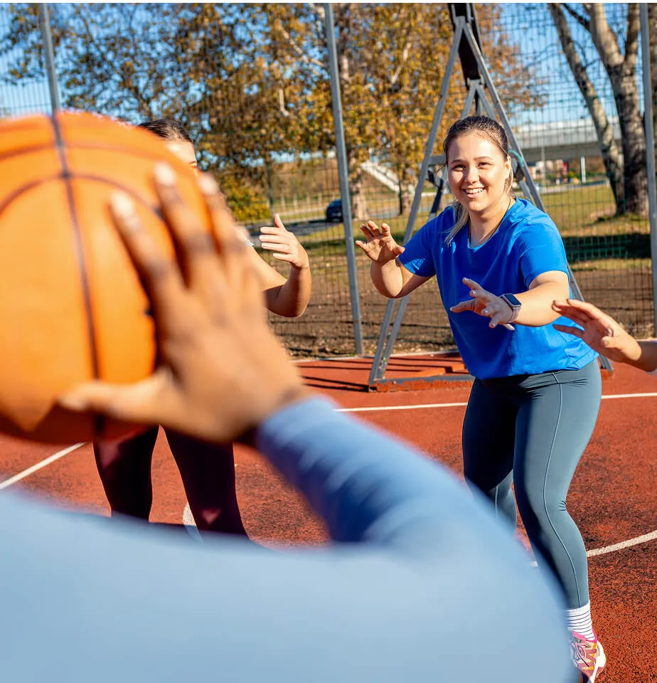 group of kids playing basketball