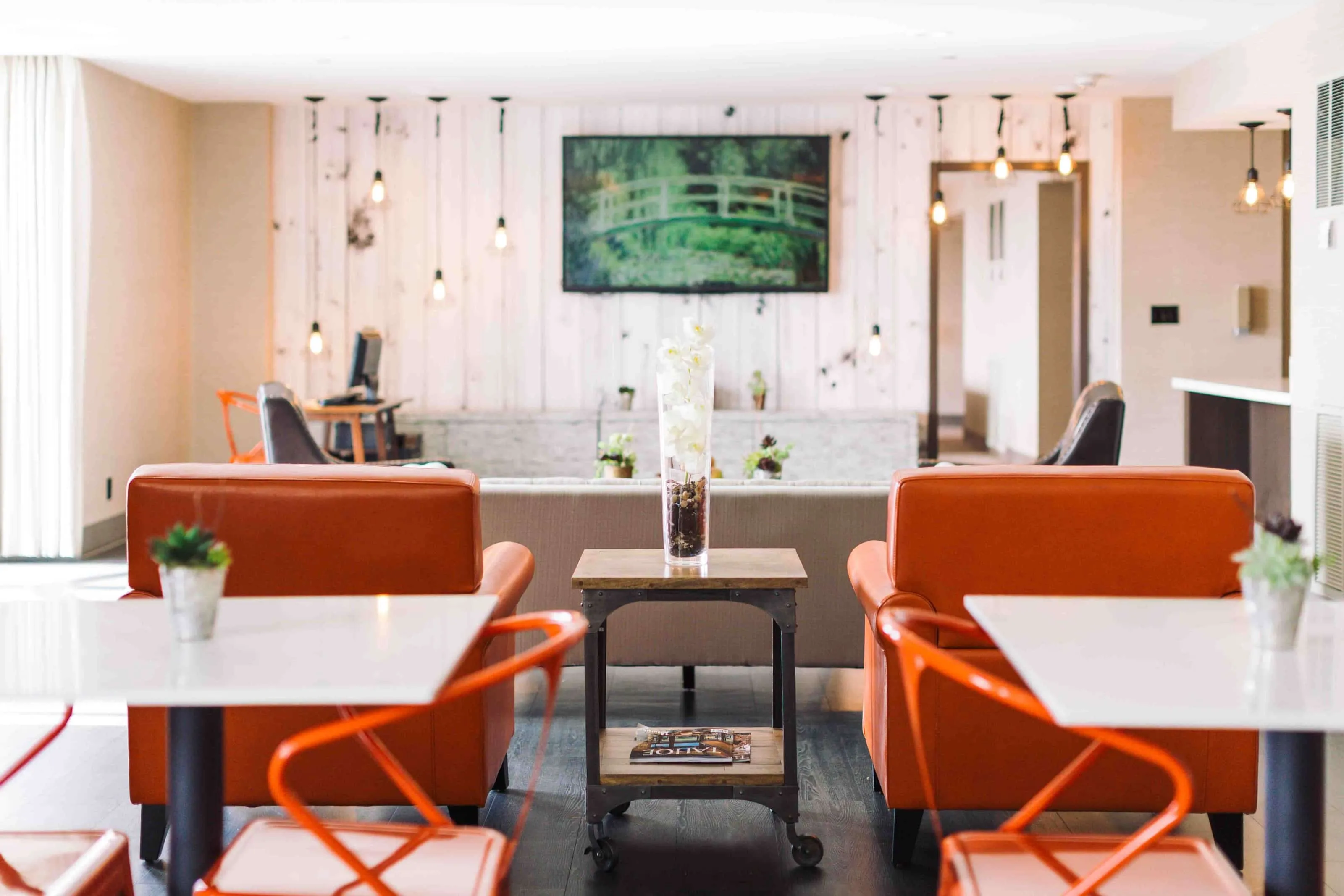Whitney Peak Club Lounge with orange seating and a refreshment counter