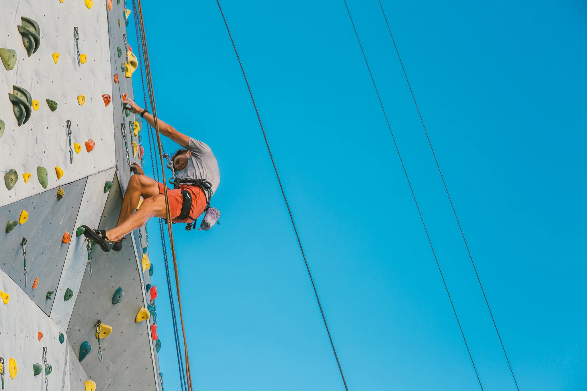 Climber on Whitney Peak's outdoor climbing wall