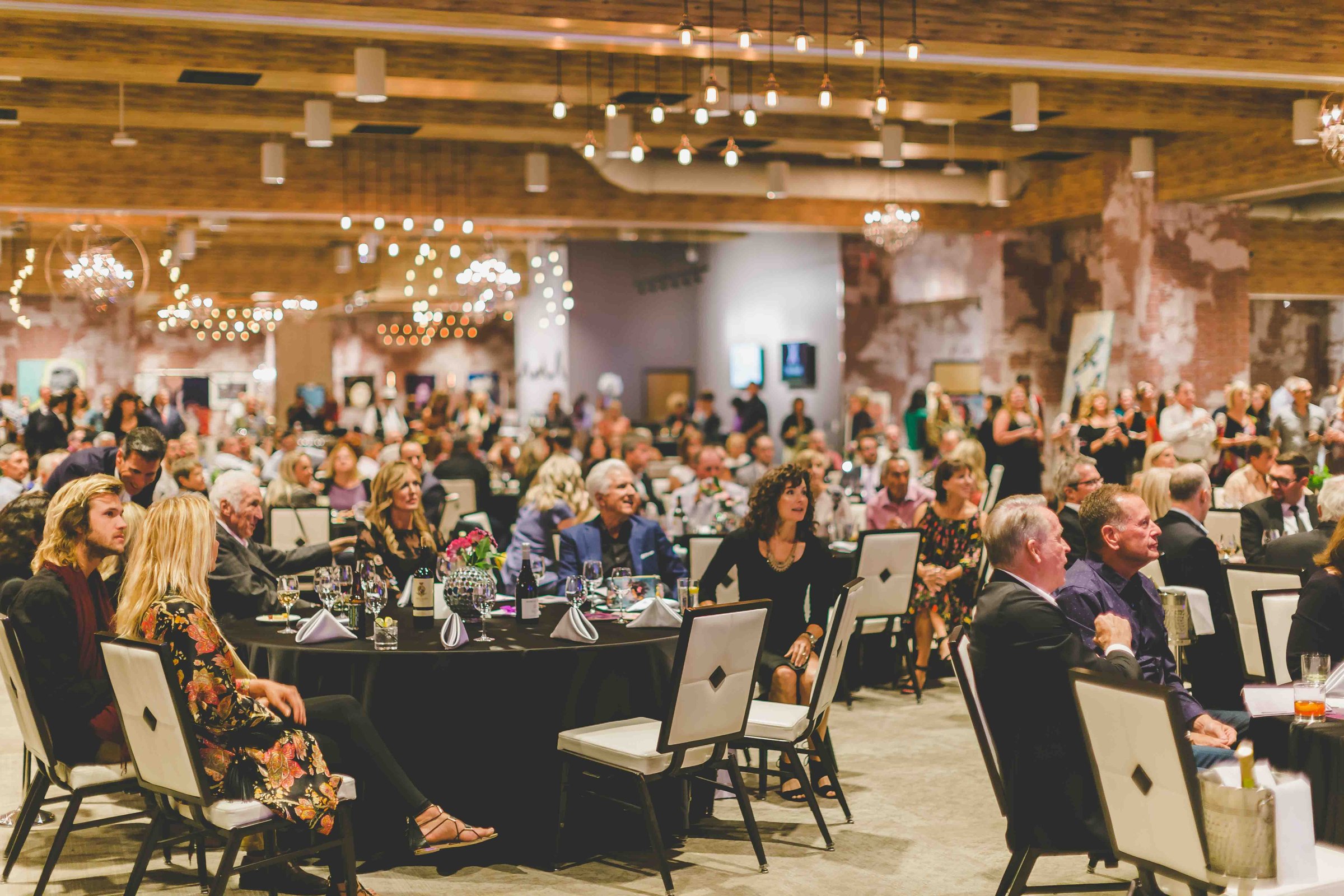 Guests filling the third-floor event space at Whitney Peak Hotel