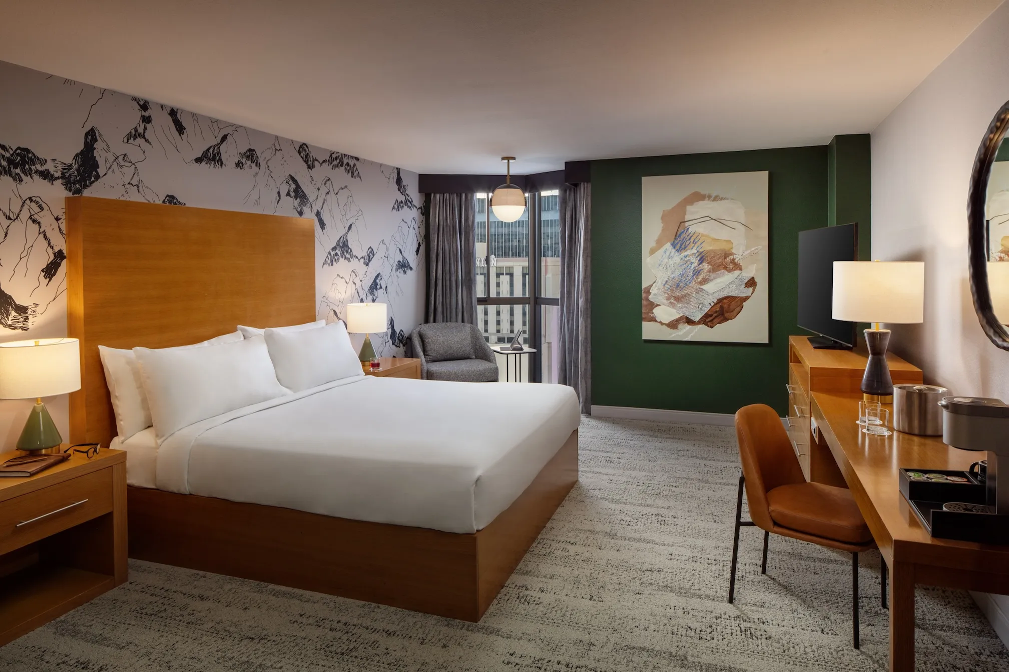 Guest room at Whitney Peak Hotel with a king bed and mountain-inspired artwork