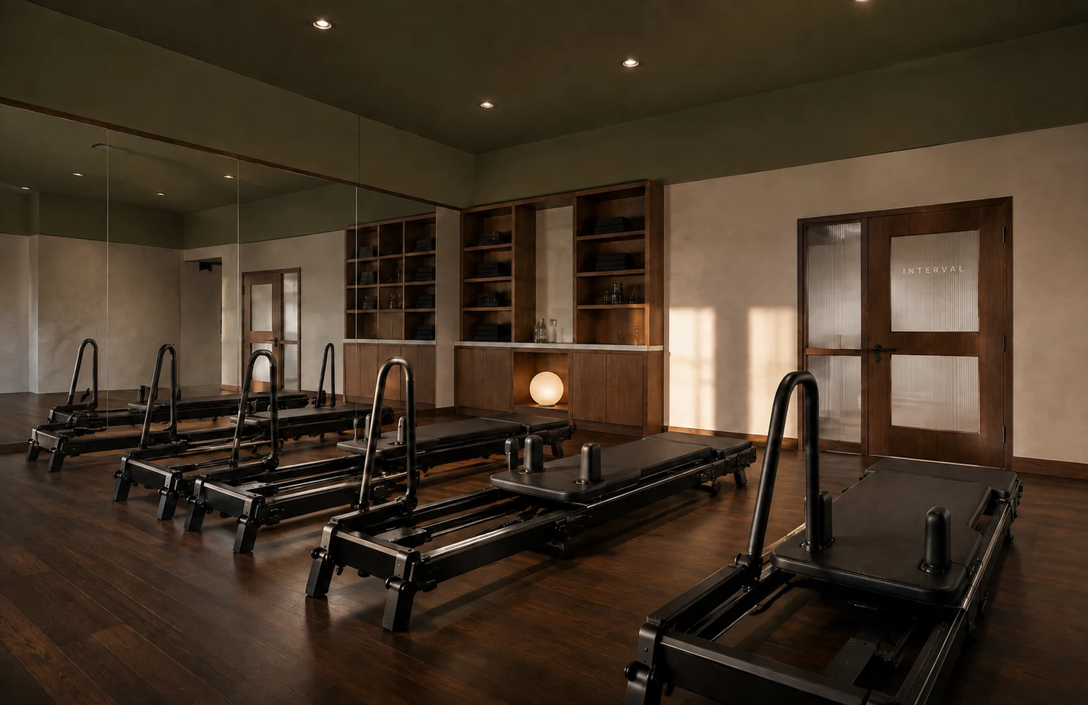 Design rendering of the planned Interval training studio with oakmoss ceiling and warm wood finishes