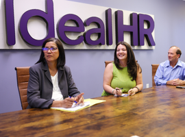 a smiling employee in the conference room