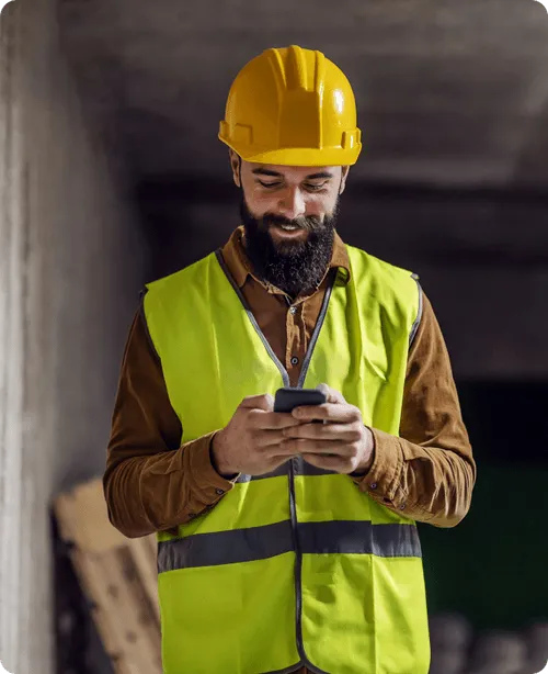 man on phone looking for hotels for construction workers
