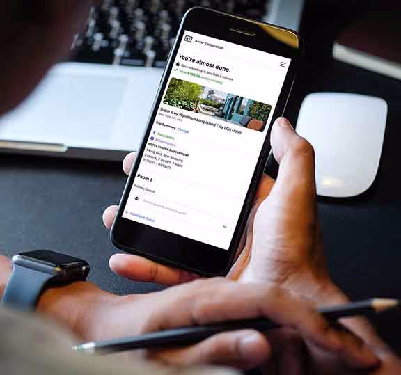 Travel enjoying Hotel Engine's hotel discount app on his phone