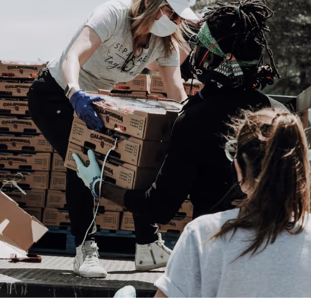 A nonprofit group carrying boxes
