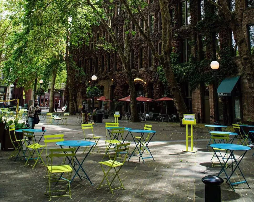 Blue and green cafe tables in a park in Seattle