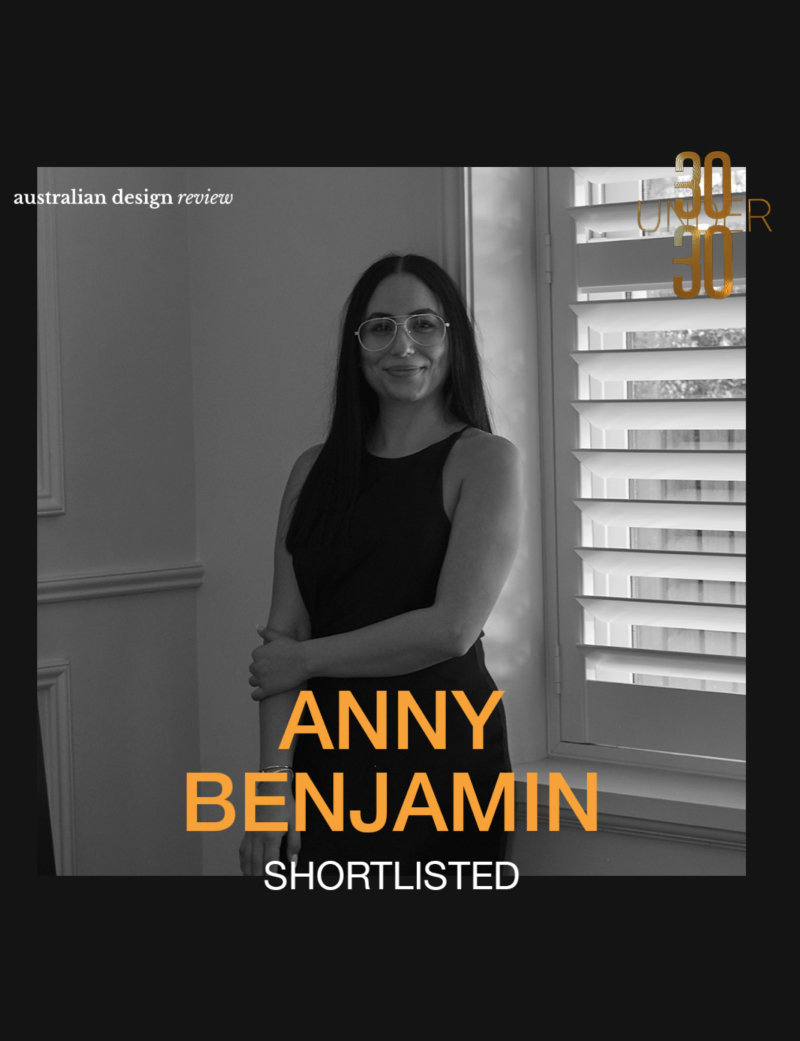 A chair in front of an abstract image