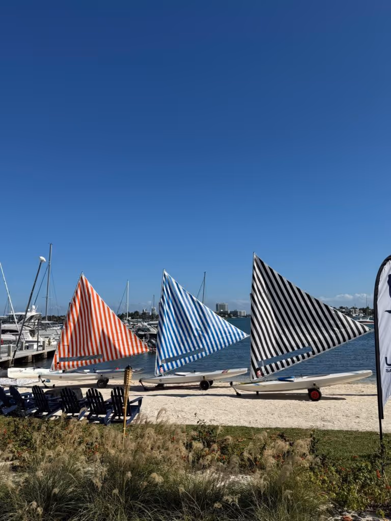 Show how the beach and boats are used as canvas for art