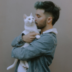 A man kissing a cat - Pets Care Veterinary Clinic Webflow Template