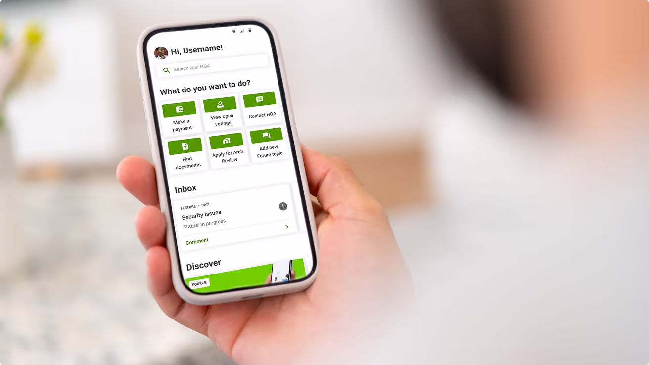 Person using HOA mobile app to manage payments, documents, and community requests on smartphone