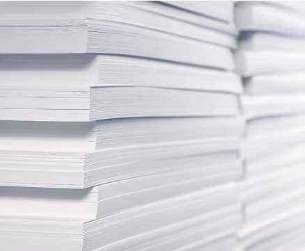 Close-up view of a large stack of white paper sheets.