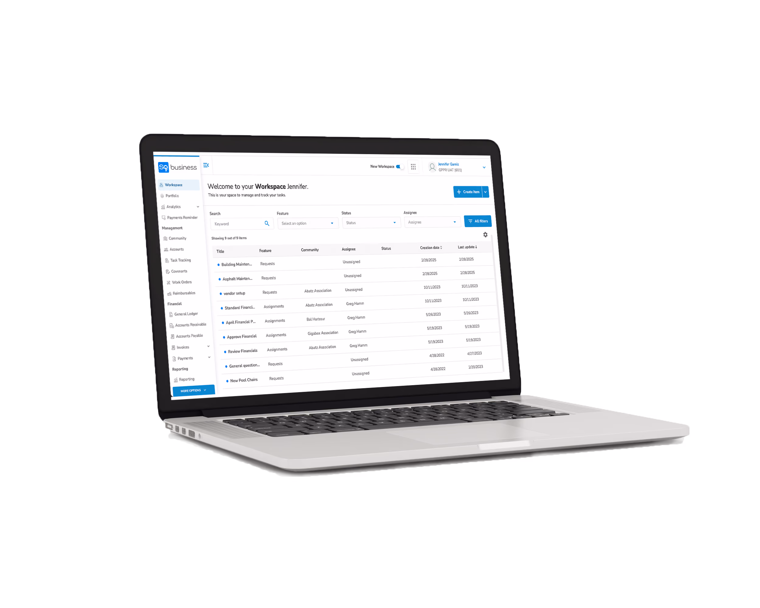 Laptop displaying a workspace dashboard with task management details including titles, features, status, assignees, and creation dates.