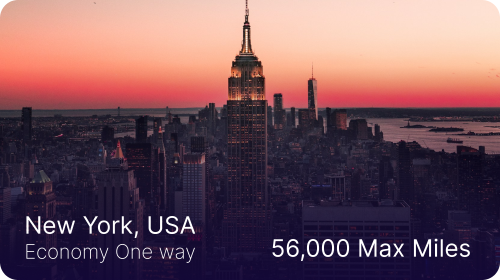New York City skyline at sunset with the Empire State Building illuminated, advertising Economy One way flights with 56,000 max miles.