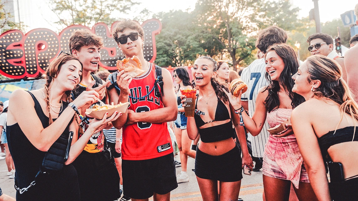 Group of young people eating at lollapalooza