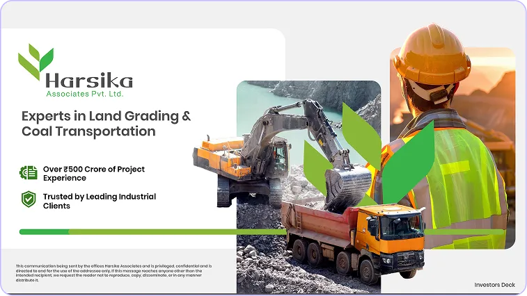 A man in a hard hat and safety vest standing next to a truck.