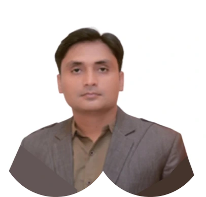 A man in a gray jacket and brown shirt.