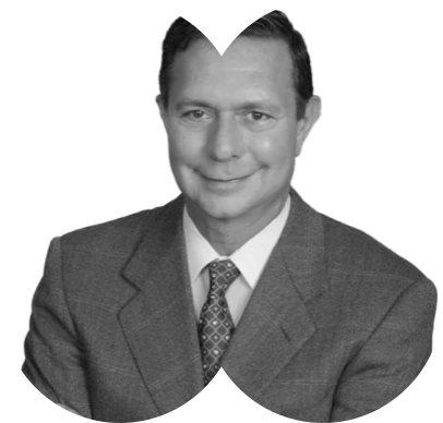 A black and white photo of a man in a suit.